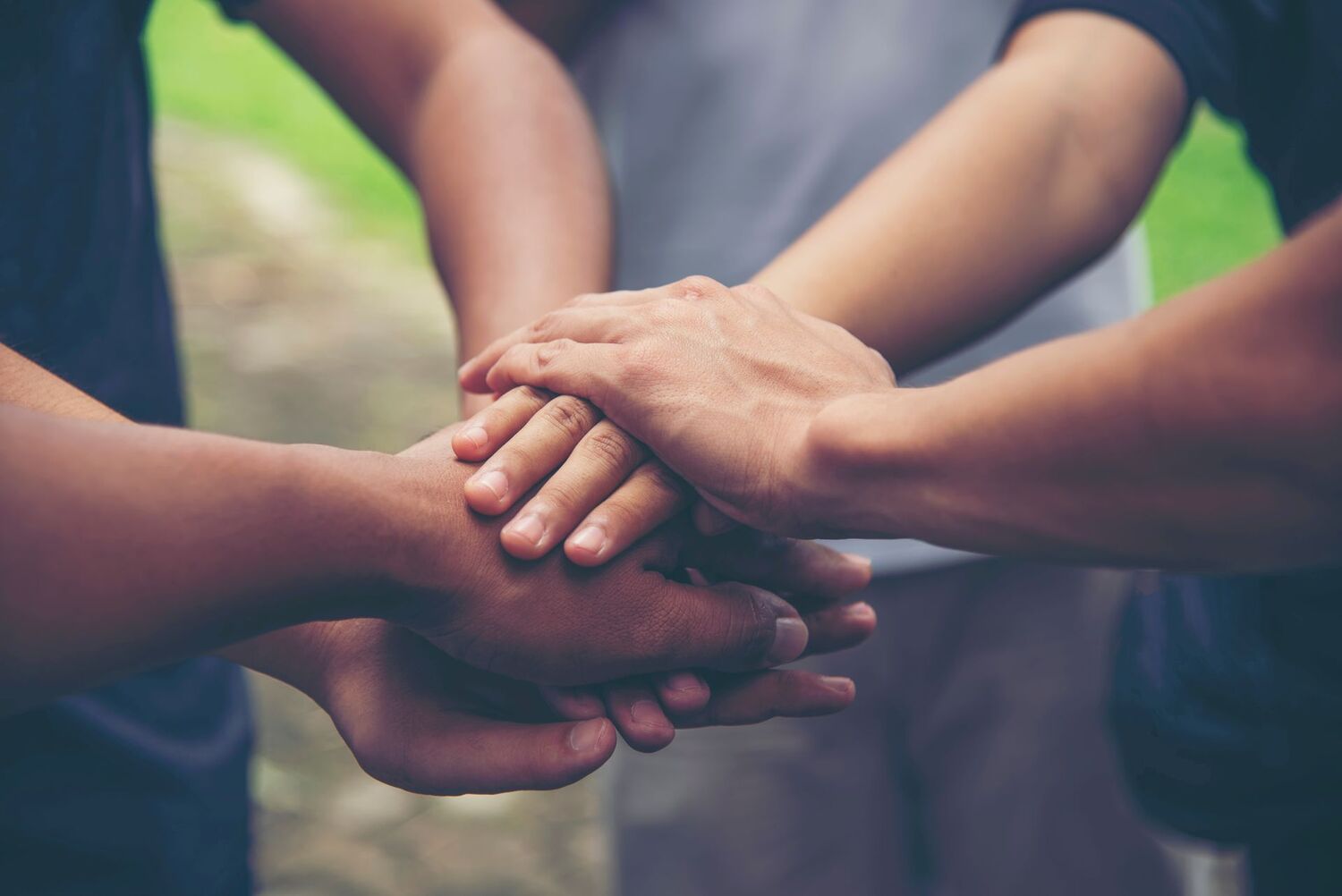 Solidarity unite people hands together community teamwork. Hands of spirit team working together outdoor. Unity strong handshake with people or agreement of feeling or happy diverse education action